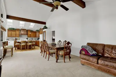 a living room with a table and a couch at Vivienda De Osos Walk to the Lake Spacious Fawnskin Retreat Chalet in Fawnskin