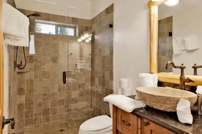 a bathroom with a sink and a shower at Morning Star Log Cabin at Big Bear Ultra-Modern Castle Glen Mountain Chalet in Big Bear Lake