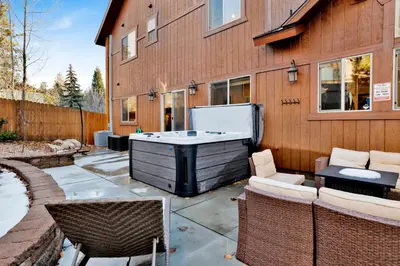 a backyard with a tub and chairs and a building at Morning Star Log Cabin at Big Bear Ultra-Modern Castle Glen Mountain Chalet in Big Bear Lake