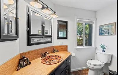 a bathroom with a sink and a toilet at Relaxing 4 bedroom Mountain Stay in Lake Arrowhead