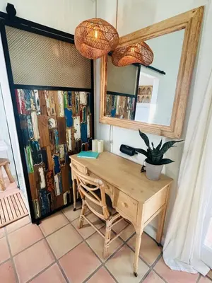 a room with a wooden table and a mirror at Ojai Serenity Retreat in Ojai