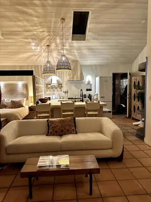 a living room with a couch and a kitchen at Ojai Serenity Retreat in Ojai
