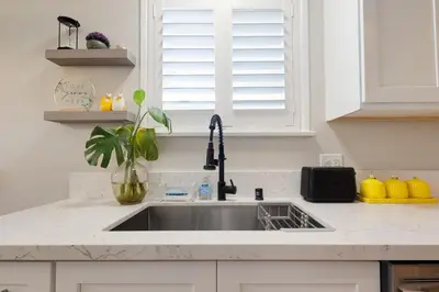 a kitchen counter with a sink and a window at Elegant 3 Bedroom 2 Bathroom With EV Charging Near Santa Anita in Duarte