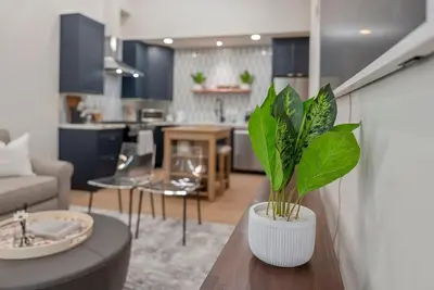 a living room with a table with a plant on it at New 1 BR, King Bed, Laundry In-Unit, Parking in Los Angeles