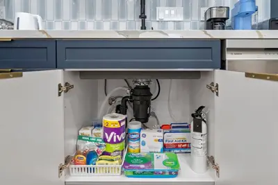 a shelf under a sink with toiletries underneath it at New 1 BR, King Bed, Laundry In-Unit, Parking in Los Angeles