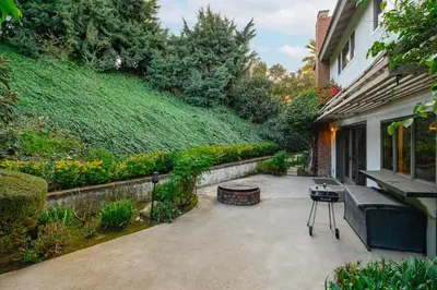 a patio with a bench next to a house at Serene Hilltop Oasis Above the City w Private Pool in Hacienda Heights