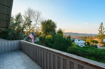 an american flag on the balcony of a house at Serene Hilltop Oasis Above the City w Private Pool in Hacienda Heights
