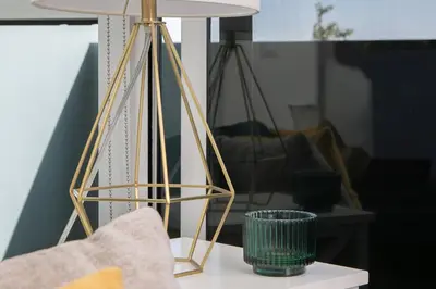 a lamp on a table in a living room at Stylish Santa Monica Apt Free Parking & Wi-Fi in Los Angeles