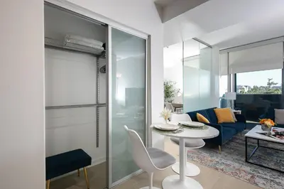 a living room with a table and a couch at Stylish Santa Monica Apt Free Parking & Wi-Fi in Los Angeles