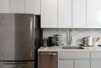a kitchen with a stainless steel refrigerator and a sink at * Soho Vibes In The Heart Of Santa Monica * in Los Angeles