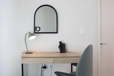 a desk with a lamp and a mirror on it at * Soho Vibes In The Heart Of Santa Monica * in Los Angeles