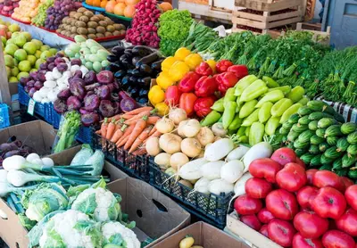 a display of fruits and vegetables in boxes at a market at Laugh in the Lap of Luxury In SM * FREE Parking * in Los Angeles