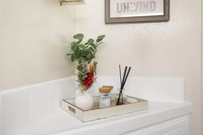 a shelf with a vase and a plant on it at Santa Monica's Prestige Place *Steps To The Beach* in Los Angeles