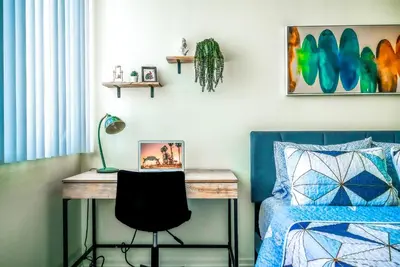 a bedroom with a desk and a bed at Oceanview Penthouse Luxury Stay Steps To the Beach in Los Angeles