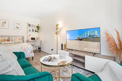 a living room with a couch and a tv at * Sand & Surf In The Heart Of Santa Monica * in Los Angeles