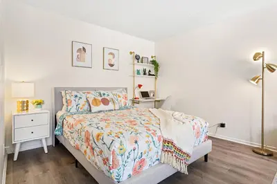 a white bedroom with a bed and a night stand at * Sand & Surf In The Heart Of Santa Monica * in Los Angeles