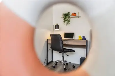 an office with a desk with a computer and a chair at SoCal Luxurious Apt Steps To The Beach & Pier in Los Angeles
