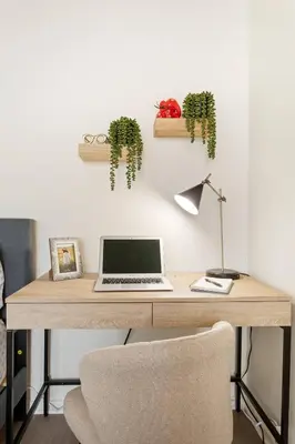 a desk with a laptop and plants on the wall at Ocean Lover's Dream Studio In Santa Monica in Los Angeles