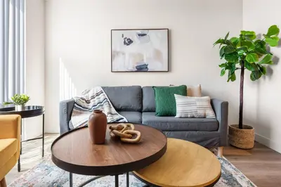 a living room with a couch and a table at 5 Star 1BR Apartment w/ Free Parking & Fast WiFi in Los Angeles