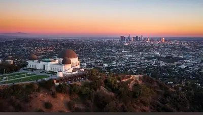 a building on top of a mountain with a city at 5 Star 1BR Apartment w/ Free Parking & Fast WiFi in Los Angeles