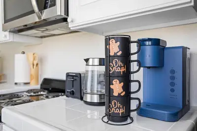 a kitchen counter with two coffee mugs on it at 5-star West Hollywood Living | Modern & Central in Los Angeles