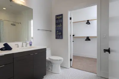 a bathroom with a toilet and a sink and a shower at West Hollywood Luxe | 2BR/2BA Resort Style in Los Angeles
