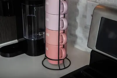 a pink cup on a counter next to a blender at West Hollywood Luxe | 2BR/2BA Resort Style in Los Angeles