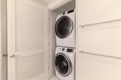 two washer and dryer in a white laundry room at Santa Monica 1BR apt with Parking in Los Angeles