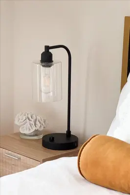 a black lamp on a night stand next to a bed at Santa Monica 1BR apt with Parking in Los Angeles
