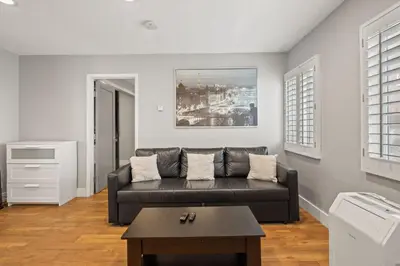 a living room with a couch and a table at Modern 1BR • Steps to Venice Beach in Los Angeles