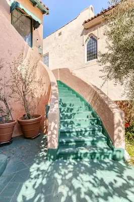a stairway with green water in front of a building at Cozy 3-Bedroom Home in K-town Los Angeles in Los Angeles