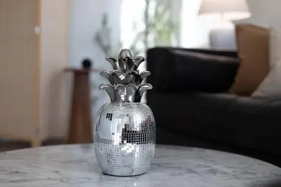 a silver vase sitting on top of a table at King Bed, Gym, Hot Tub, Parking in Thousand Oaks