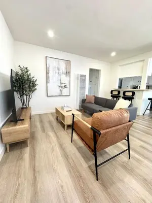 a living room with a couch and a table at Private Flat 15 min to Pasadena, DTLA, JPL in Alhambra