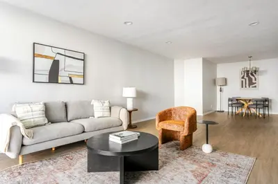a living room with a couch and a table at Blueground Westwood balcony nr UCLA LAX-1397 in Los Angeles