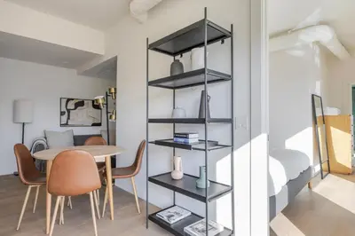 a room with a table and chairs and a dining room at Blueground East Hollywood balcony nr Echo Park LAX-1336 in Los Angeles