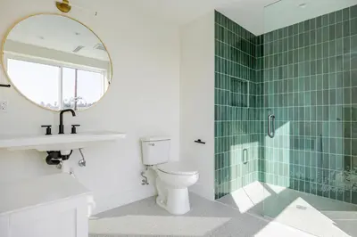 a bathroom with a toilet and a shower with a mirror at Blueground East Hollywood balcony nr Echo Park LAX-1336 in Los Angeles