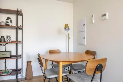 a dining room with a wooden table and chairs at Blueground East Hollywood rooftop nr Hollywood Bowl LAX-1334 in Los Angeles