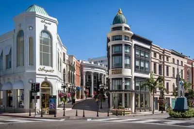 a street in a city with buildings and a clock tower at 3 beds Apart in Beverly Hills in Los Angeles