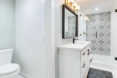 a bathroom with a toilet and a sink and a shower at Walk to Lake Arrowhead Village! Home with Lake Views in Lake Arrowhead