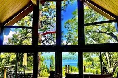 a window view of a lake from a house at Surreal Feel Lakeview #B (Upstairs) in Lake Arrowhead