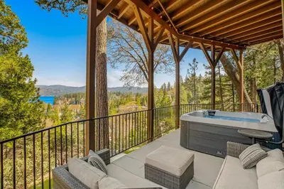 a hot tub on the deck of a house at Surreal Feel Lakeview #B (Upstairs) in Lake Arrowhead