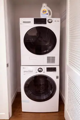 a white washer and dryer in a room at Penthouse Corner 3 Bedroom Condo with Large Private Balcony and Parking in Los Angeles