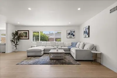 a white living room with a couch and a table at NEW Remodeled Northridge 5 Bedroom Near CSUN & Sherwood Forest in Northridge