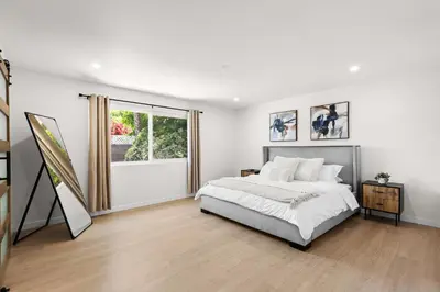 a white bedroom with a bed and a window at NEW Remodeled Northridge 5 Bedroom Near CSUN & Sherwood Forest in Northridge