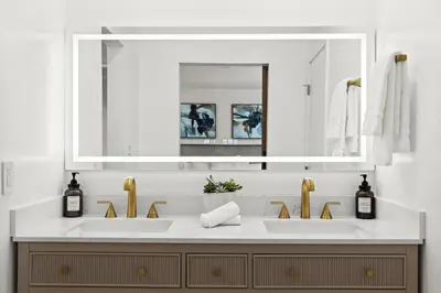 a bathroom with two sinks and a large mirror at NEW Remodeled Northridge 5 Bedroom Near CSUN & Sherwood Forest in Northridge