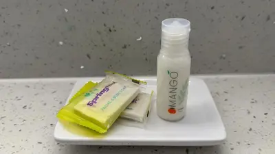 a toothbrush and a bottle of milk on a plate at Florentine Motel And Studio in Bell