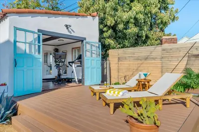 a deck with two chairs and a hammock at Bohemian Dream Studio Close to LA Stadium SOFI Kia Forum Intuit Dome LA Coliseum in Los Angeles