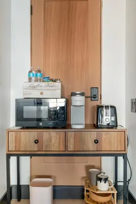 a counter with a microwave and a toaster oven on it at Bohemian Dream Studio Close to LA Stadium SOFI Kia Forum Intuit Dome LA Coliseum in Los Angeles