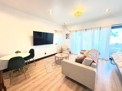 a living room with a couch and a table at Bohemian Dream Studio Close to LA Stadium SOFI Kia Forum Intuit Dome LA Coliseum in Los Angeles