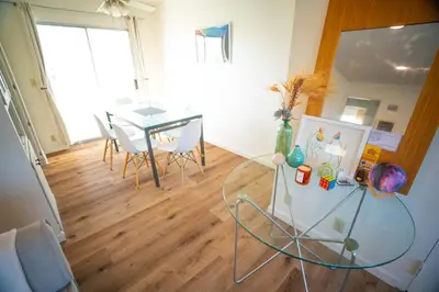 a living room with a glass table and a dining room at Bright and Comfortable 2 Bedrooms with Views in Santa Monica in Los Angeles